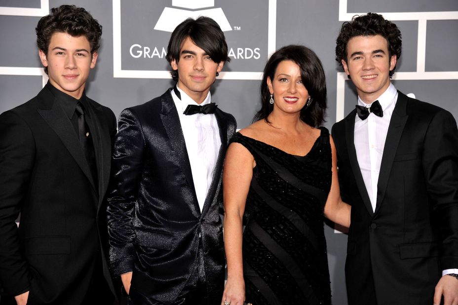 Nick, Joe and Kevin Jonas, better known as the Jonas Brothers, attend the 2009 Grammy Awards with their mother, Denise Jonas. Denise often makes guest appearances on Kevin's E! reality show "Married to Jonas."