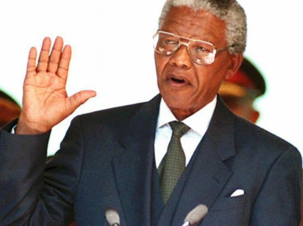 South African President Nelson Mandela takes the oath 10 May 1994 during his inauguration at the Union Building in Pretoria..