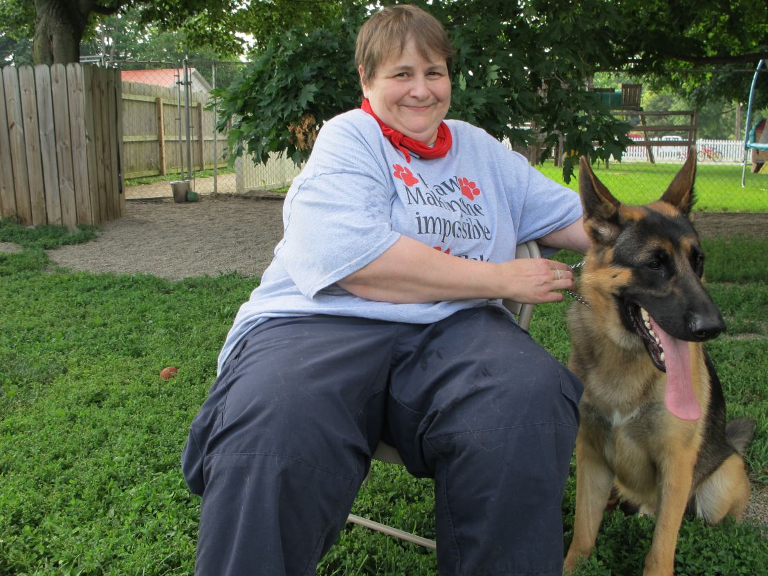 Karen Shirk, pictured here with Gabriel, matches service dogs and people through her nonprofit, 4 Paws for Ability.