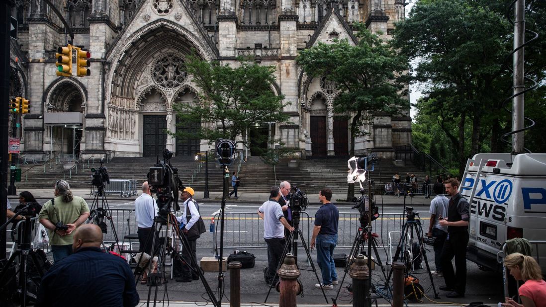 Members of the media congregate outside the Cathedral Church of St. John the Divine in New York City prior to the funeral of James Gandolfini on Thursday, June 27.