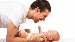 Young Caucasian father playing with baby son; Shutterstock ID 138388331; 