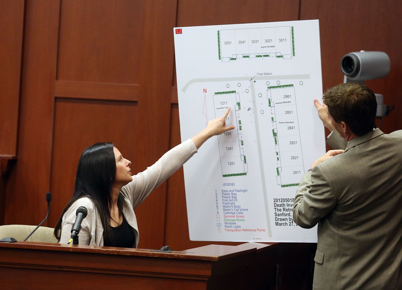 Witness Jennifer Lauer points to where her former home was in the Retreat at Twin Lakes community during questioning by defense attorney Mark O'Mara on June 27. Lauer called 911 on the night of the shooting.
