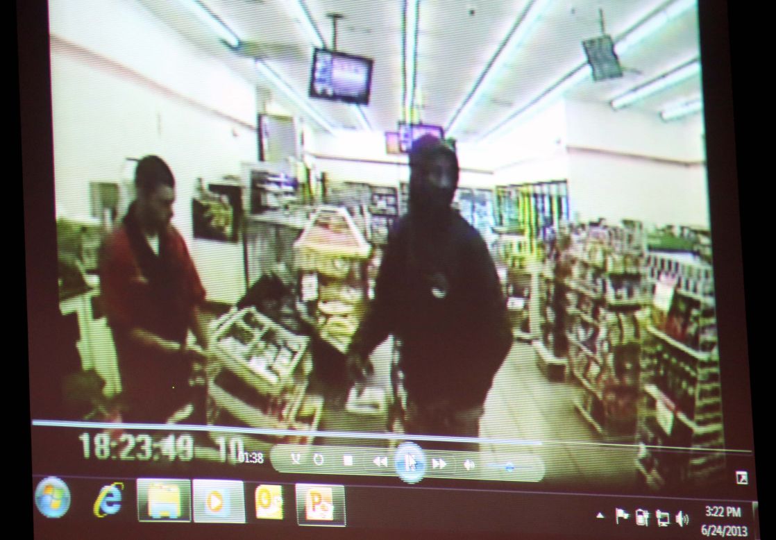 A video entered as evidence is displayed on June 24. It shows  Martin, right, at a 7-Eleven on the night of his shooting.