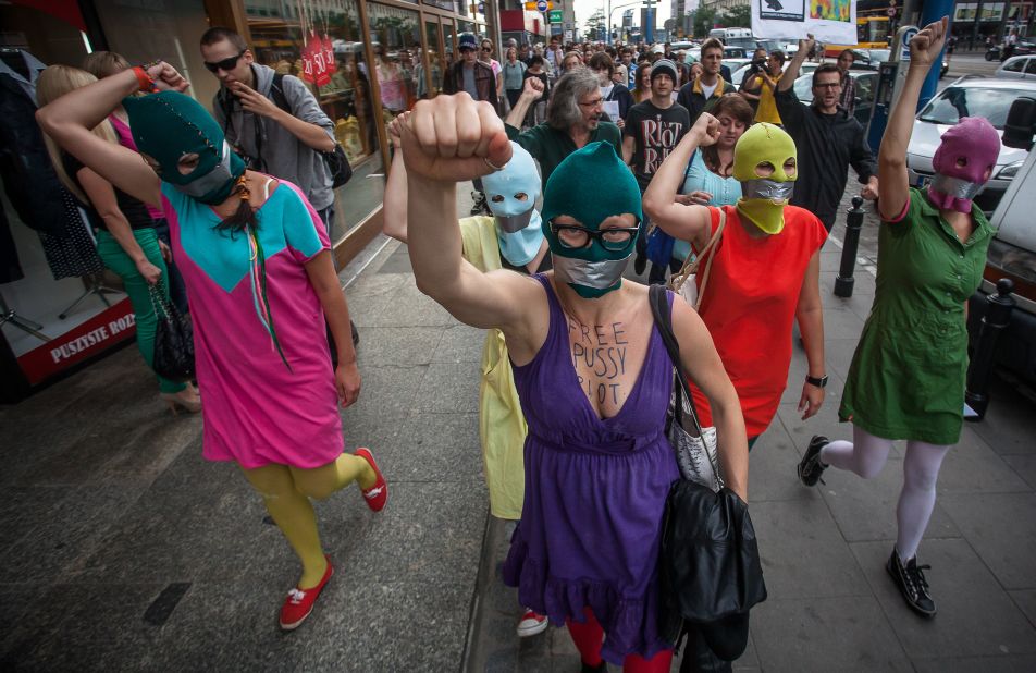 <a href="http://www.cnn.com/2012/08/17/world/pussy-riot-social-media/index.html">Supporters of the Russian punk band Pussy Riot</a> wear masks and tape their mouths during a protest in front of the Russian embassy in Warsaw on August 17, 2012. The colorful ski masks were popularized by the feminist rockers.