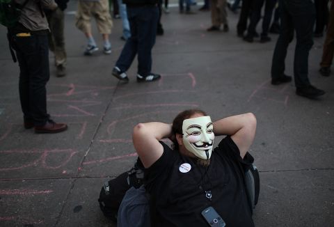 An Occupy protester wears a Guy Fawkes mask during a May Day demonstration on May 1, 2012, in Oakland, California. The mask has become a symbol of the Occupy movement.
