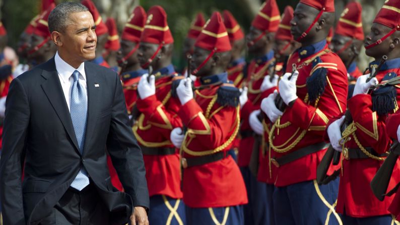 President Obama reviews an honor guard outside the presidential palace in Dakar on June 27.