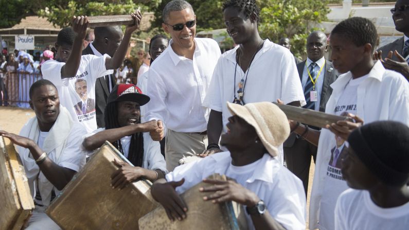 Obama speaks with locals as he tours Goree Island off the coast of Dakar on June 27.