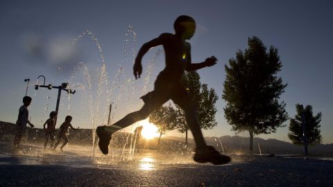 Ashawn Rabb, 5, runs through a fountain at the Red Ridge Park in Las Vegas on June 27.