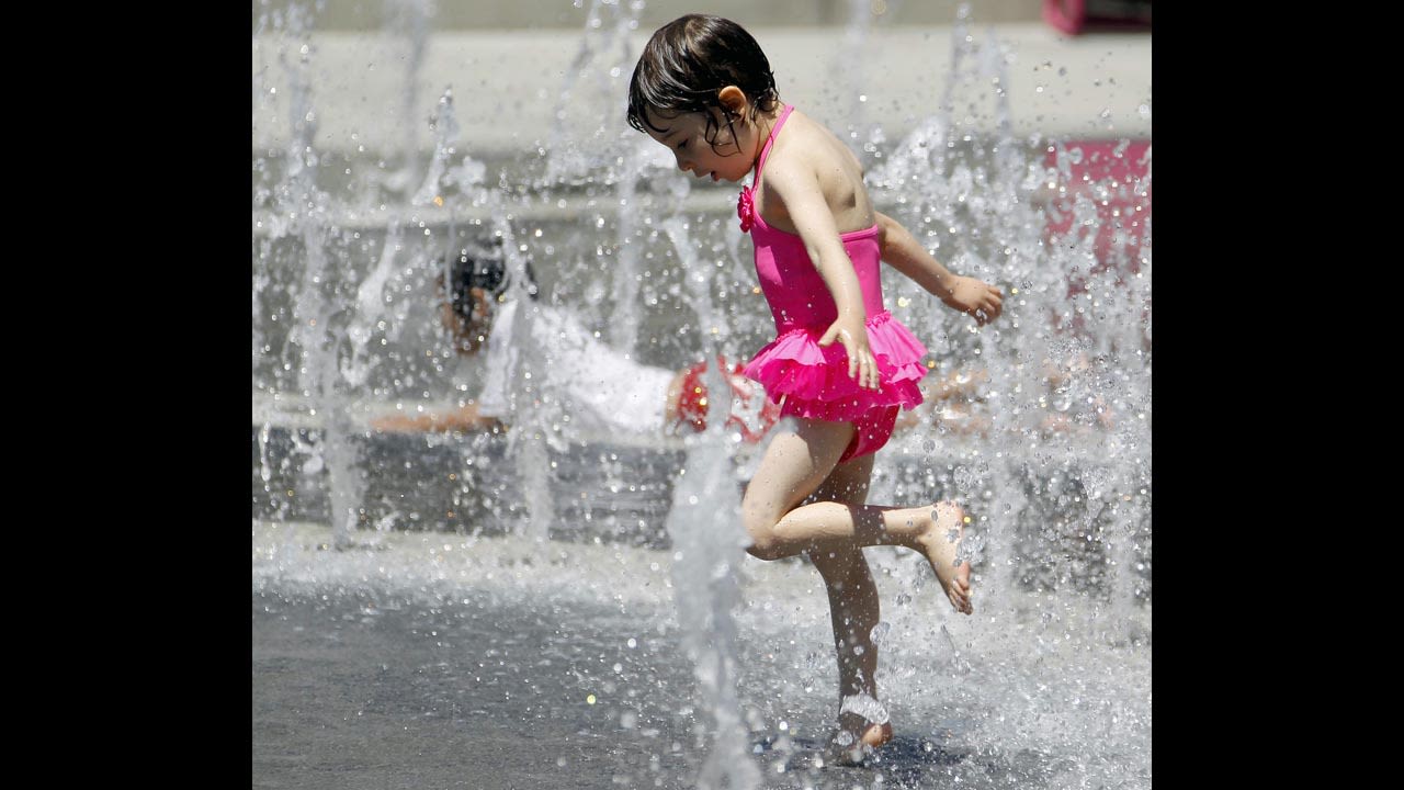 Betty Lu Guapo, 4, cools off at the Los Angeles Fountain on June 27.