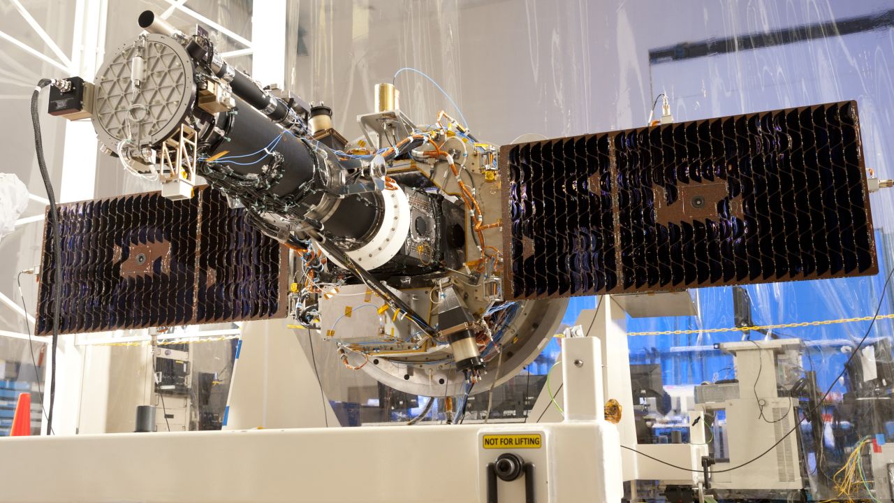 NASA's Interface Region Imaging Spectrograph (IRIS) is seen with its solar panels open during testing at a Lockheed Martin facility in California.