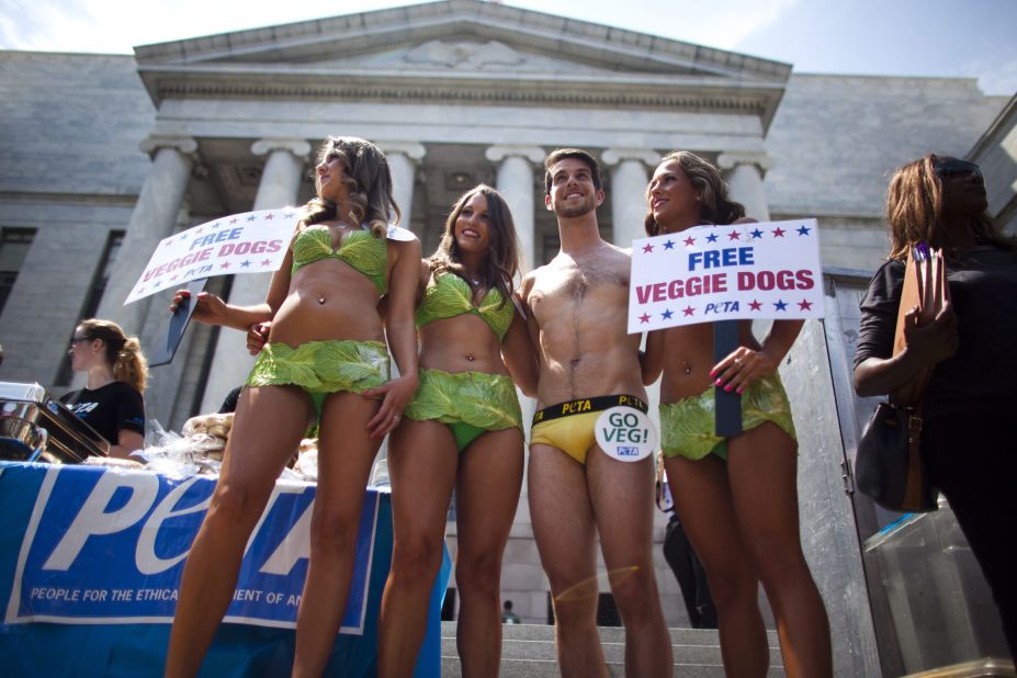 PETA "lettuce ladies" and a "banana boy" prepare to serve vegan hotdogs to passers-by in Washington on July 11, 2012. Not afraid of showing a bit of skin, the animal rights organization is known for using controversial tactics to bring attention to its causes.