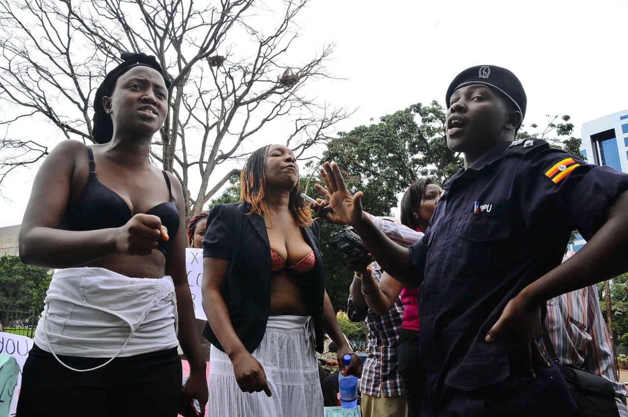 Bra-clad women confront a police officer in Kampala, Uganda, on April 23, 2012. The demonstration was held to protest the alleged sexual assault of a high-profile female opposition politician by a police officer during her arrest. Six women were arrested after they refused to put their shirts on. 