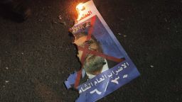A picture of Egyptian President Mohammed Morsi burns on the ground as anti-government protesters demonstrate on June 26, 2013 in Cairo, Egypt.