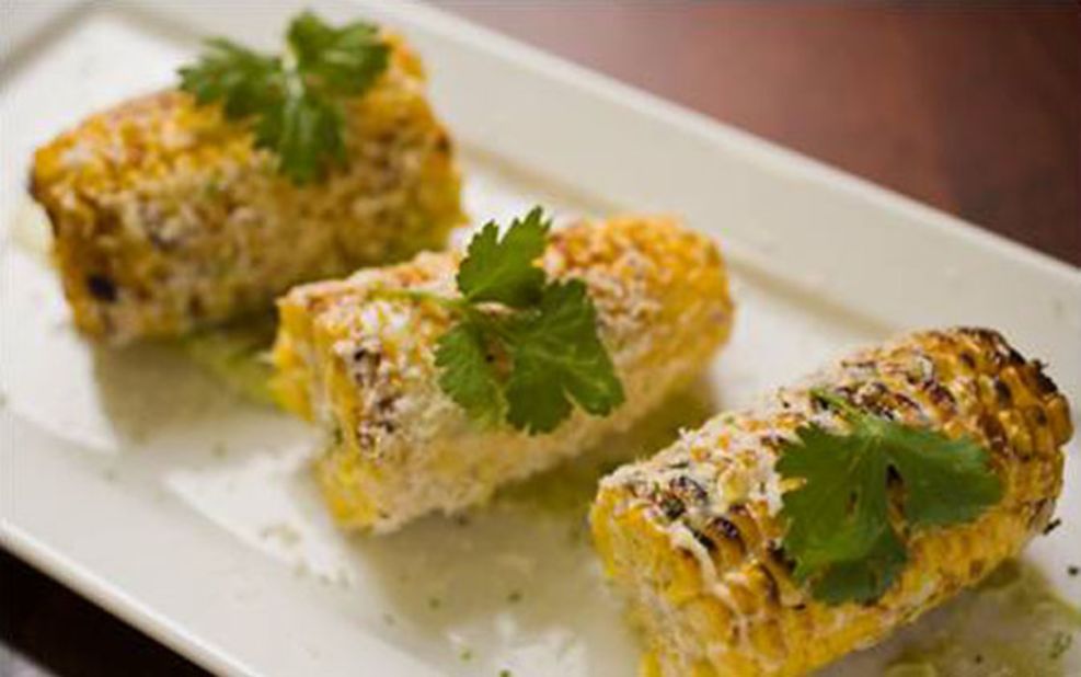 To rest well, you've got to eat well. Star chef Todd English serves his signature Argentinean, European and American fusion (including this gourmet corn) at Bonfire Restaurant in Terminal B.