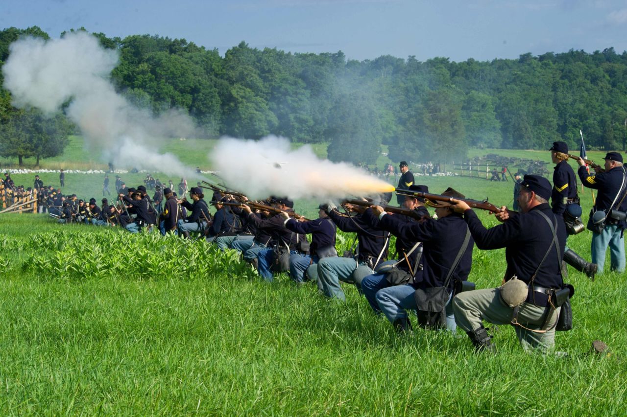 Union soldiers fire a volley at Confederate troops.