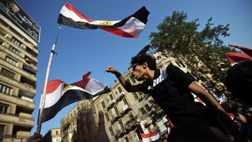 An Egyptian man chants slogans during a demonstration against president Mohammed Morsi and the Muslim Brotherhood in Egypt's landmark Tahrir square on June 28, 2013. Supporters and opponents of Egyptian Islamist President Mohamed Morsi took to the streets for rival protests a year after his election, as clashes in Alexandria raised fears of widespread unrest. AFP PHOTO/GIANLUIGI GUERCIAGIANLUIGI GUERCIA/AFP/Getty Images