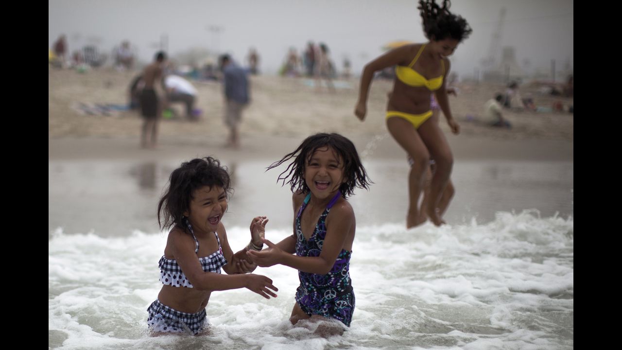 Alana Griego, 5, left, and Celeste Hidalgo, 7, cool off in the Pacific Ocean in Santa Monica, California, on June 28.
