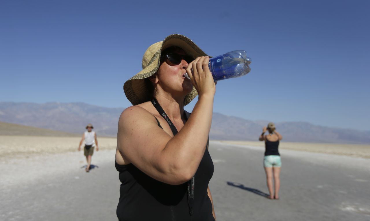 Maria Wieser of Italy takes a drink of water while sightseeing in Death Valley National Park in California on June 28. 