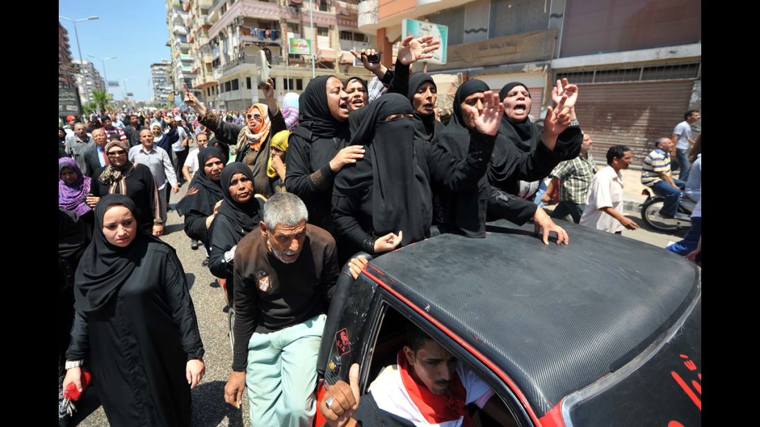 Mourners shout slogans during journalist Salah Hassan's funeral on June 29 in Port Said.