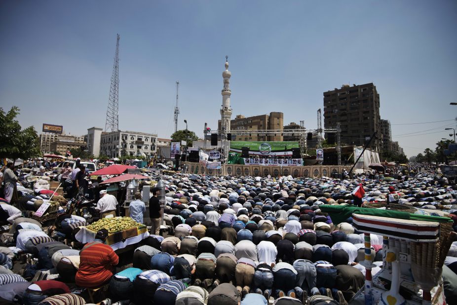 Thousands of Muslim Brotherhood supporters conduct Friday prayers in front of a Cairo mosque before the start of a sit-in for Morsy on June 28.