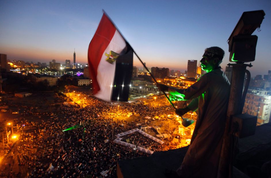 A  protester waves a national flag over Tahrir Square on Friday, June 28.