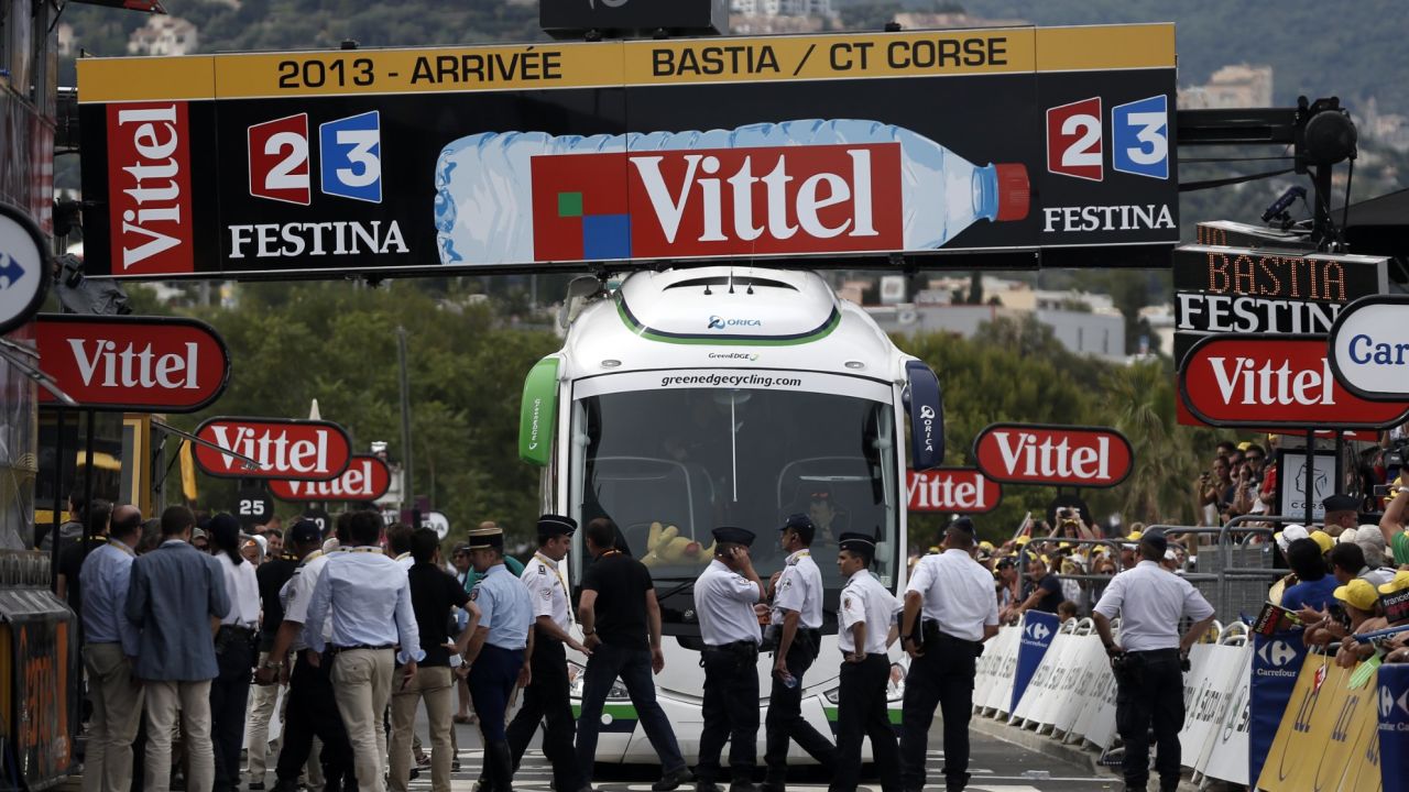 The Orica GreenEdge team bus is trapped under the finishing line of the first stage of the Tour de France
