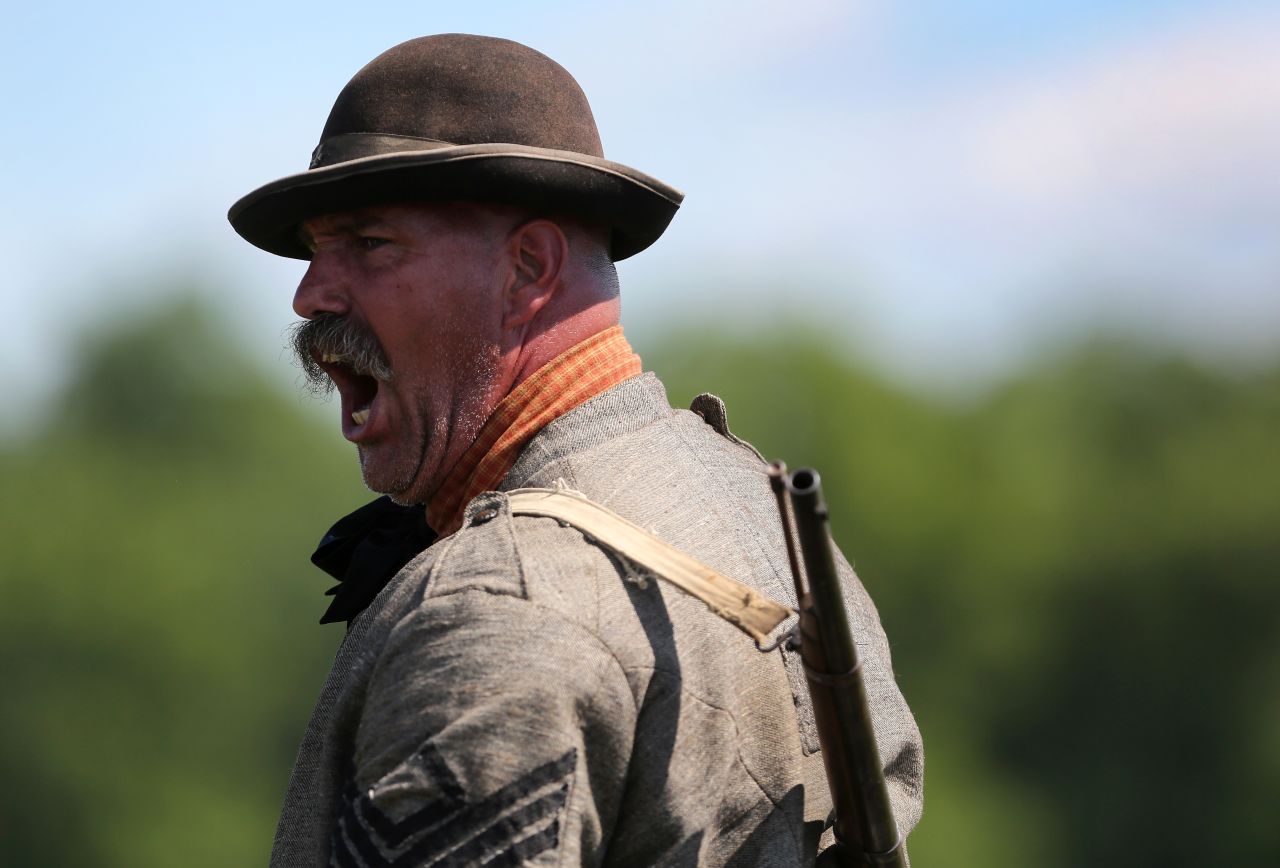 A Confederate soldier yells orders during a reenactment in Gettysburg on June 29.