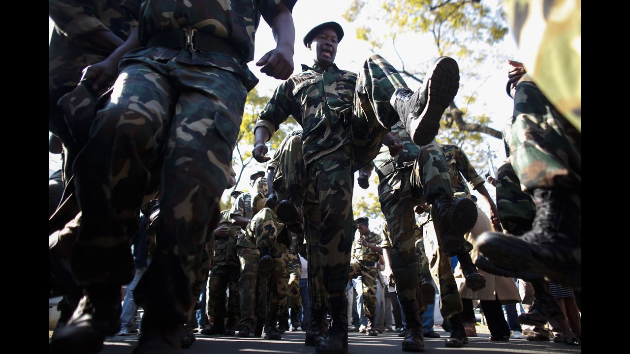 South African military veterans dance in support outside the hospital on June 30.