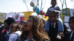 Well-wishers sing outside the hospital where former South African President Nelson Mandela is being treated in Pretoria, South Africa, on Sunday, June 30.
