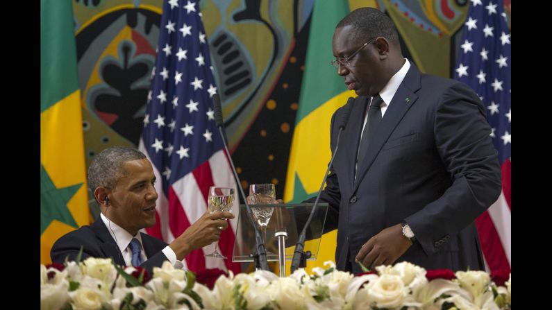 Obama toasts with Senegalese President Macky Sall during an official dinner at the Presidential Palace in Dakar on Thursday, June 27.