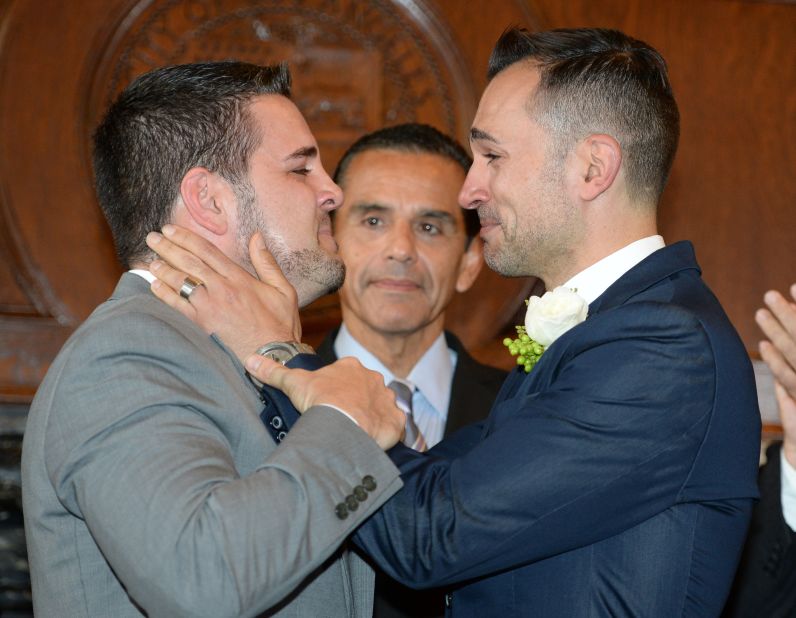 Jeff Zarillo, left, and Paul Katami, plaintiffs in the California case against Proposition 8, react after they are married by Los Angeles Mayor Antonio Villaraigosa at Los Angeles City Hall on June 28.