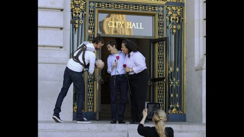A couple come out of City Hall after obtaining their marriage license in San Francisco on Friday, June 28.