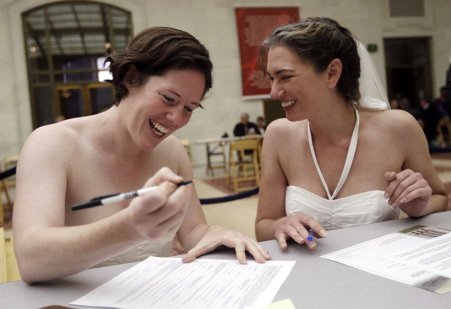 Cynthia Wides, right, and Elizabeth Carey file for a marriage certificate at City Hall in San Francisco on Saturday,  June 29. 