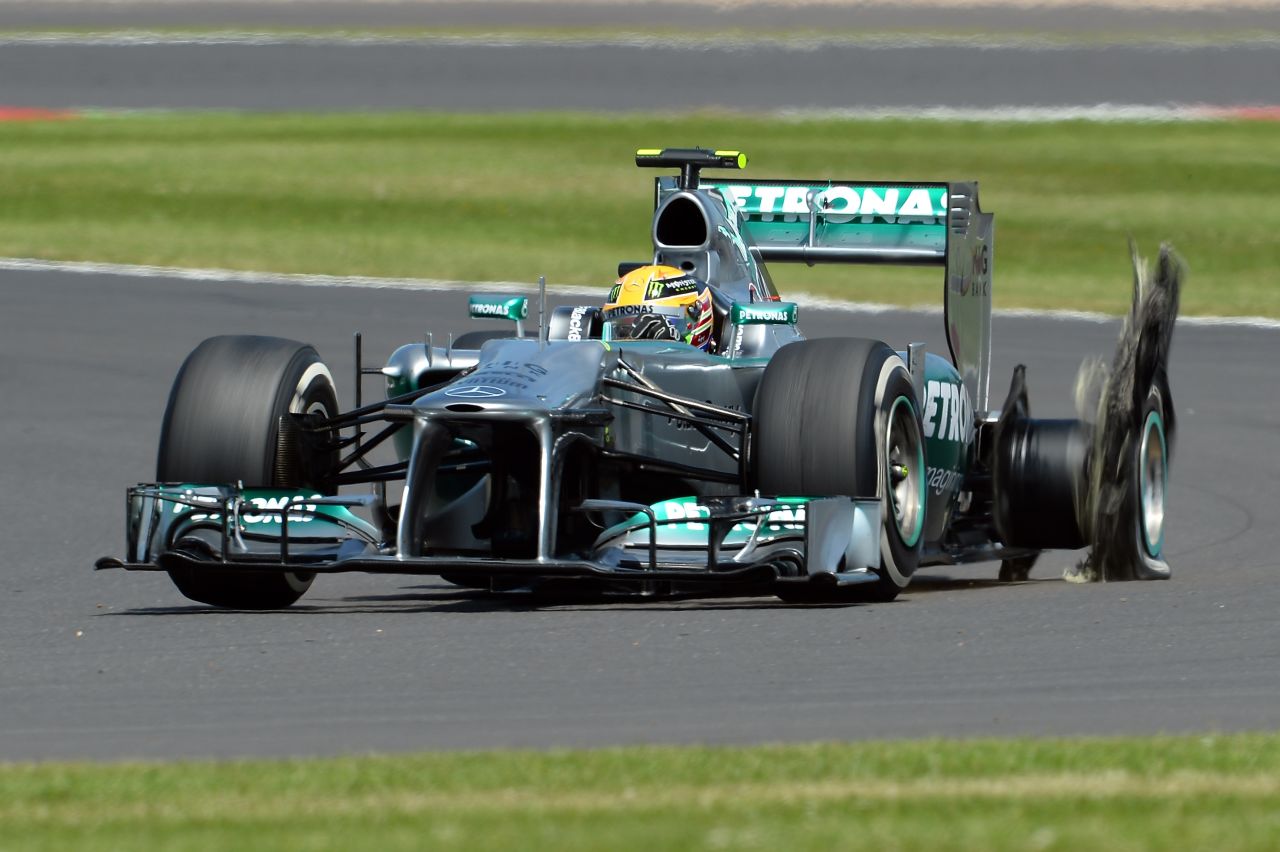 Hamilton's hopes of a home win at Silverstone ended after just eight laps when his Mercedes suffered a puncture.