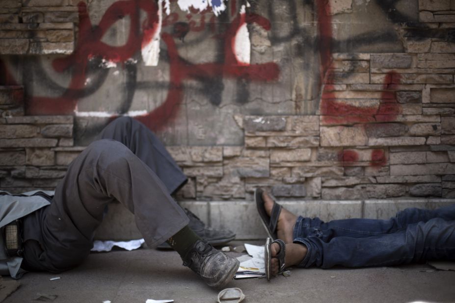 Protesters take a rest near Tahrir Square on June 30.
