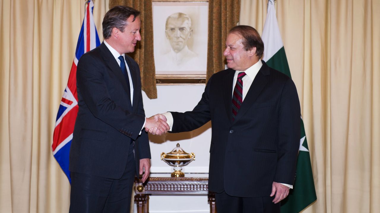 UK Prime Minister David Cameron (L) shakes hands with Pakistani Prime Minister Nawaz Sharif in Islamabad on Sunday.