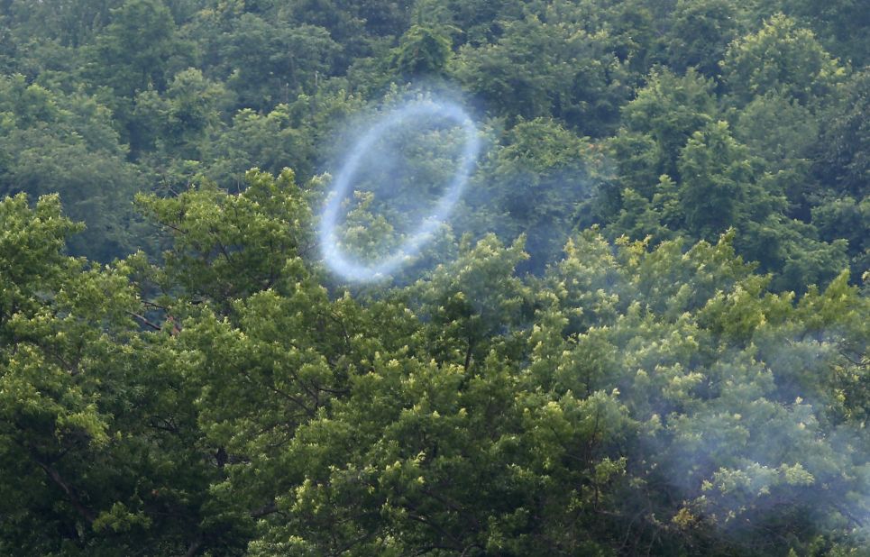 A smoke ring from a cannon fired by Confederate Civil War reenactors wafts skyward on June 30.