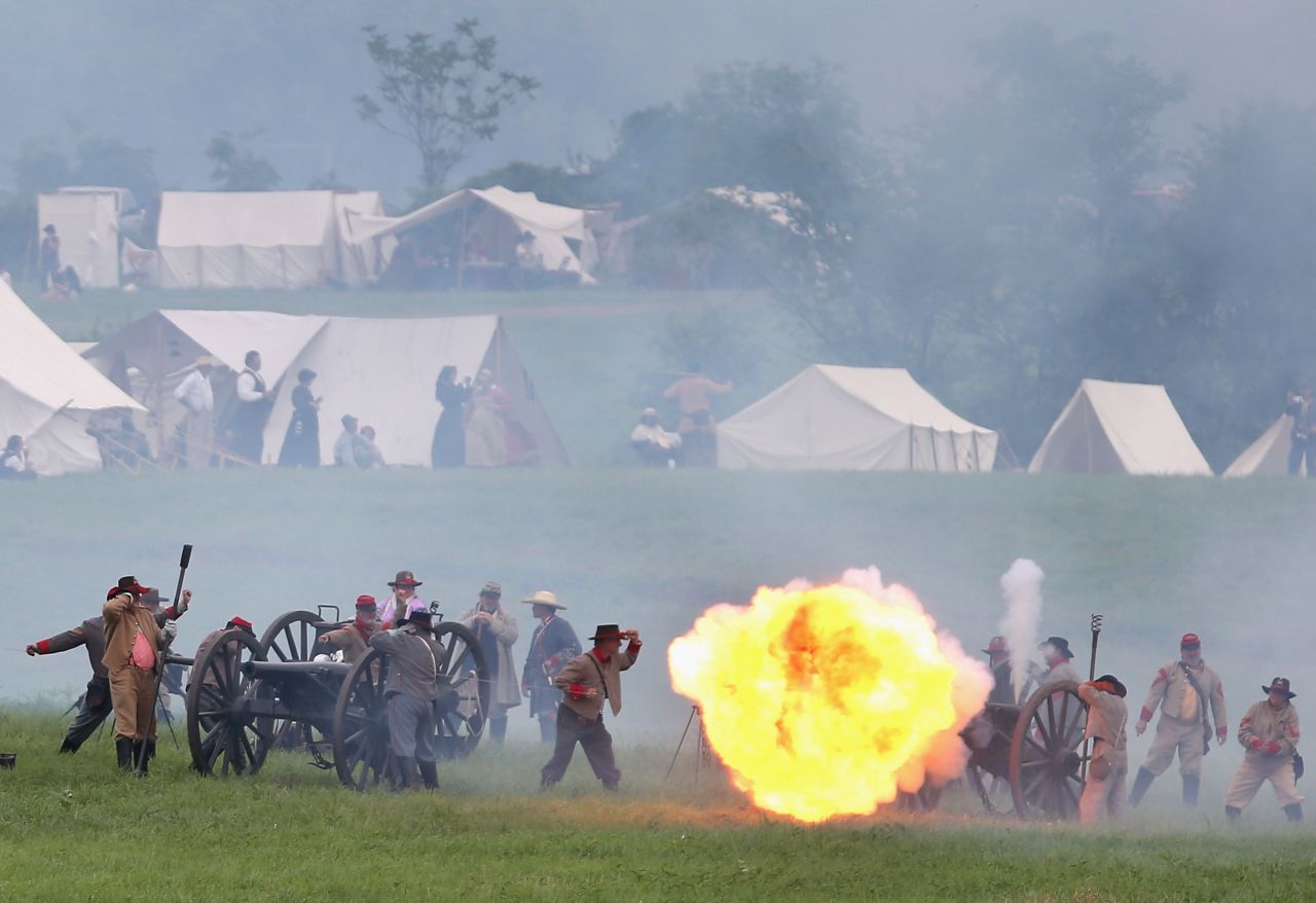 A ball of flame erupts from a Confederate canon during the reenactment on June 30. 