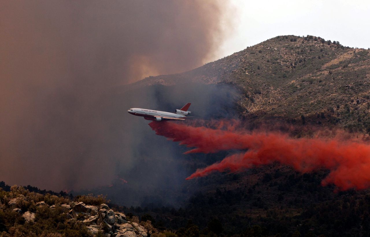 Tanker 910 makes a retardant drop on the Yarnell Hill Fire to help protect the Double Bar A Ranch near Peeples Valley on June 30.