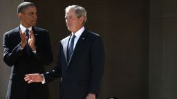 U.S. President Barack Obama (L) and former President George W. Bush (R) arrive at the opening ceremony of the George W. Bush Presidential Center April 25, 2013 in Dallas, Texas.