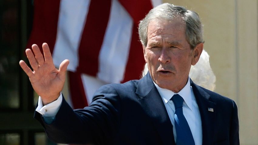 Former President George W. Bush waves goodbye after attending the opening ceremony of the George W. Bush Presidential Center April 25, 2013 in Dallas, Texas.
