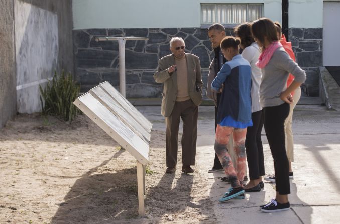 Ahmed Kathrada, a former fellow prisoner with Nelson Mandela, shows the Obama family around Robben Island  in Cape Town, South Africa, on Sunday, June 30. The island, where prisoners were banished and isolated during the apartheid era, is now a museum.