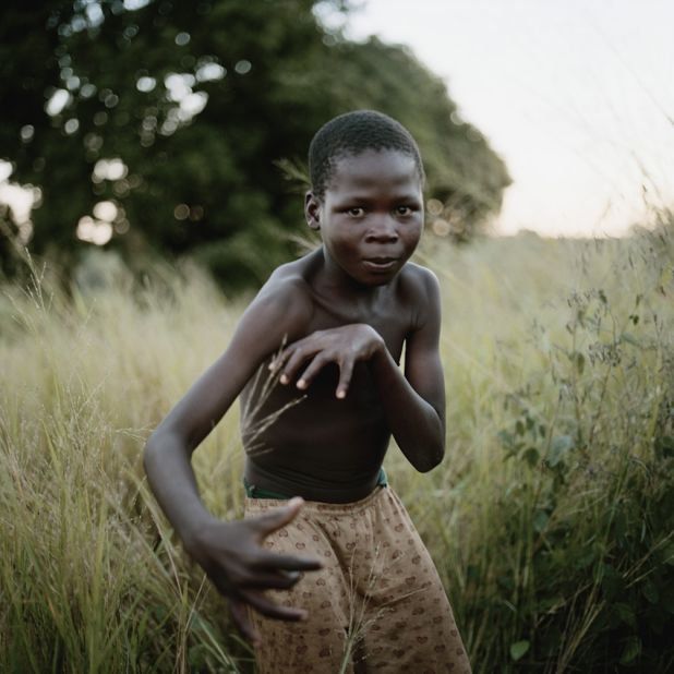 In Nhambonda, Mozambique, this boy had no ball to pose with for the photo so he created an invisible one.