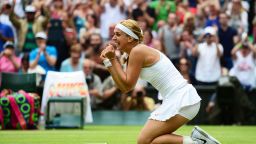 Germany's Sabine Lisicki celebrates after defeating World No.1 Serena Williams on Centre Court Monday. Lisicki prevailed 6-2 1-6 6-4 following an enthralling tussle.