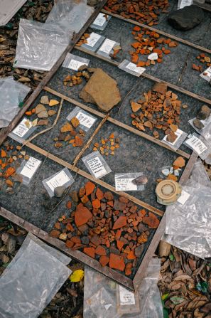 An excavation team works just outside the walls of Angkor Wat in a forested enclosure they now understand would have contained residences. Archaeologists analyze finds, from pottery shards to Ming Dynasty ceramics, to determine when people lived here.