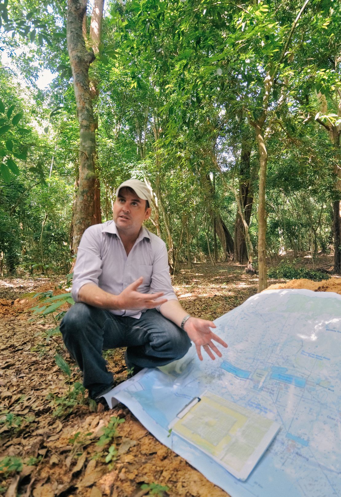 Dr. Damian Evans of the LiDAR mission uses a map to explain the monumental scale of the mega-city of Angkor.   