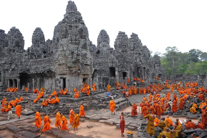 Cambodian Buddhist monks convene for a religious celebration at the famed Bayon Temple, another Angkor highlight.