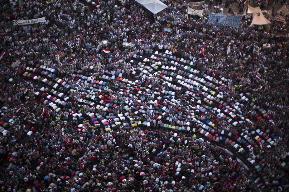 Protesters pray during a demonstration against Morsy in Cairo's Tahrir Square on Monday, July 1. Pro- and anti-government demonstrations have spread around the country surrounding the one-year mark of Morsy coming into office on Sunday, June 30.