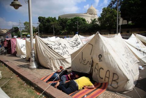 Opponents of Morsy camp out as they protest outside the presidential palace in Cairo on July 2.