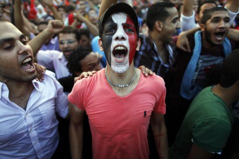 Egyptians shout slogans against Morsy in Cairo on Monday, July 1.